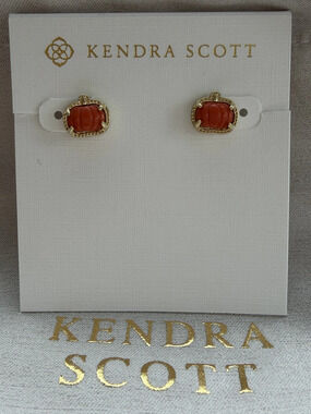 Kendra Scott's red pumpkin earrings